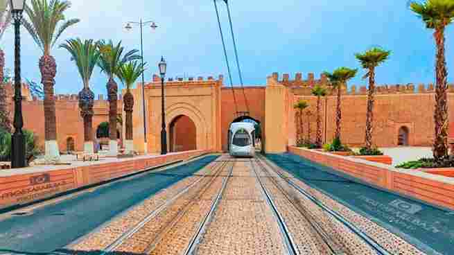 Historic walls of Taroudant, Morocco with a backdrop of Atlas Mountains,7 Days Tour from Agadir to Merzouga Desert